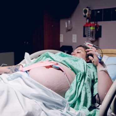 woman lying down in a hospital bed