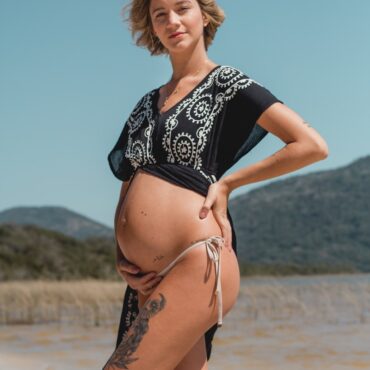 pregnant woman touching her tummy